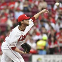 Hiroshima starter Kris Johnson pitches against the Dragons on Wednesday at Mazda Stadium. Johnson threw a one-hit shutout in the Carp's win.