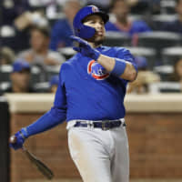 Chicago's Victor Caratini watches his three-run home run against New York in the seventh inning on Thursday night.