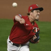 The Twins' Kenta Maeda pitches against the Indians on Friday in Minneapolis. | AP