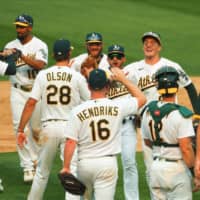 A's players celebrate after beating the White Sox in Oakland, California, on Thursday. | USA TODAY / VIA REUTERS