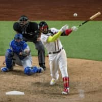 Braves designated hitter Marcell Ozuna hits his second home run of the game against the Dodgers during the seventh inning on Thursday in Arlington, Texas. | USA TODAY / VIA REUTERS