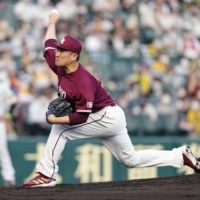 Rakuten's Masahiro Tanaka pitches against the Tigers in Nishinomiya, Hyogo Prefecture, on Sunday. | KYODO