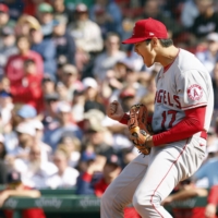 Shohei Ohtani celebrates after striking out Trevor Story during the seventh inning of the Angels' win over the Red Sox in Boston on Thursday. | KYODO