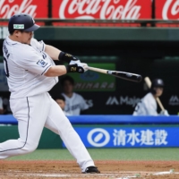 Lions slugger Takeya Nakamura homers against the Marines during their game in Tokorozawa, Saitama Prefecture, on Thursday. | KYODO