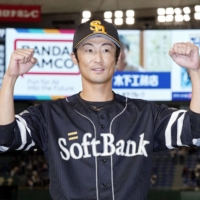 Hawks infielder Kenji Akashi celebrates after driving in the game-winning run against the Giants at Tokyo Dome on Tuesday. | KYODO