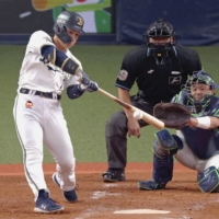 The Buffaloes' Masataka Yoshida hits a home run during Game 5 of the Japan Series at Kyocera Dome Osaka on Oct. 27. | KYODO