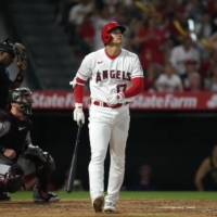 Los Angeles Angels star Shohei Ohtani watches his solo home run in the sixth inning of the team's loss to the Diamondbacks. | USA TODAY / VIA REUTERS